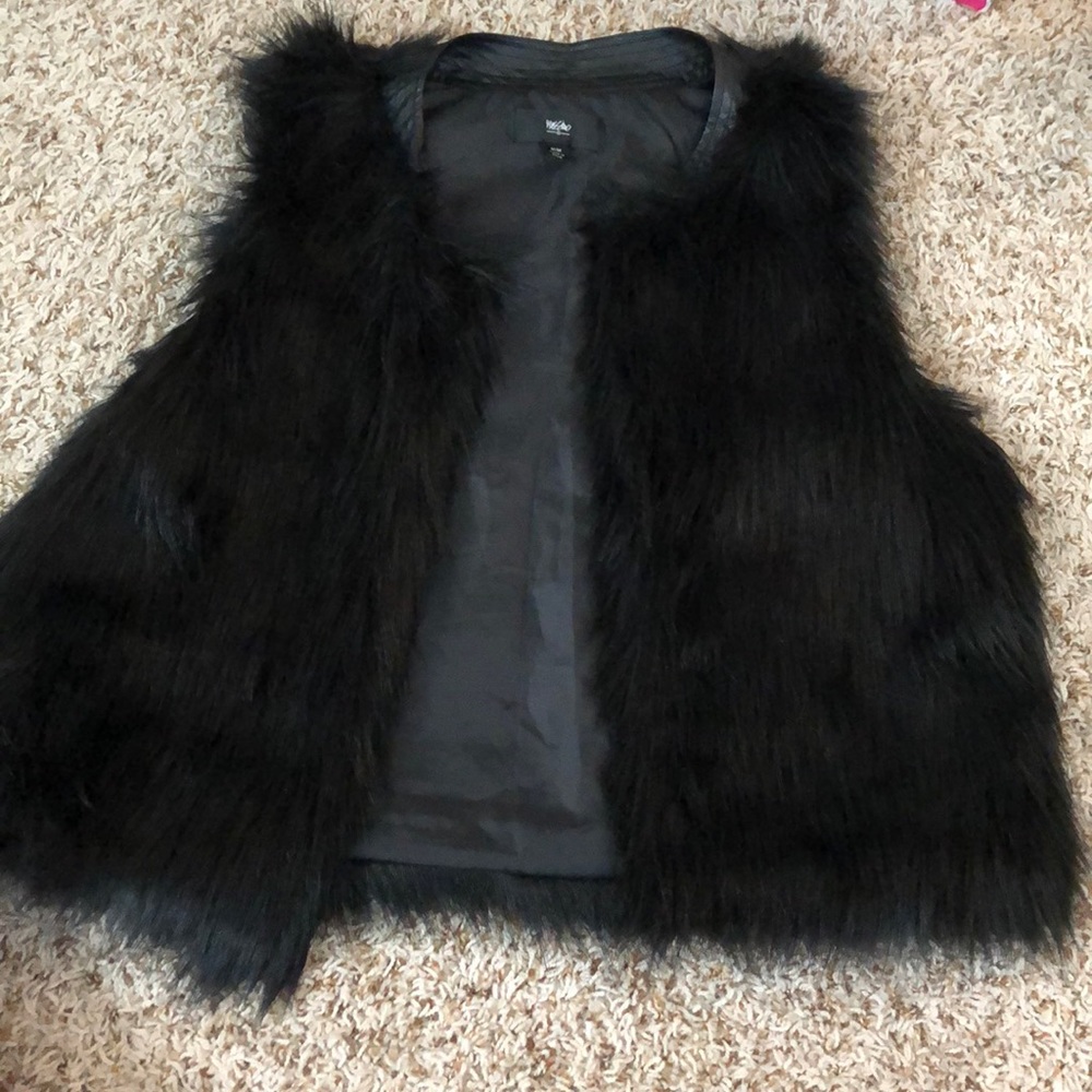 Black faux fur vest.